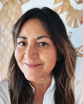 Smiling woman with long brown hair.
